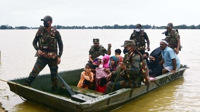 Army personnel evacuate the flood-affected victims after heavy rainfall, in the Hojai district of Assam. (ANI Photo) (Anuwar Hazarika) Army personnel evacuate the flood-affected victims after heavy rainfall, in the Hojai district of Assam. (ANI Photo) (Anuwar Hazarika)
