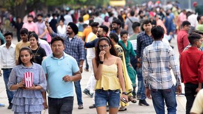 Visitors enjoying the cloudy weather at Sukhna Lake in Chandigarh on Sunday. (Keshav Singh/HT)