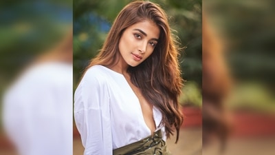 Pooja Hegde sets the internet ablaze with her recent photoshoot pictures in an oversized white shirt featuring a plunging neckline and a short criss-cross front olive green skirt. (Instagram/@hegdepooja) Pooja Hegde sets the internet ablaze with her recent photoshoot pictures in an oversized white shirt featuring a plunging neckline and a short criss-cross front olive green skirt. (Instagram/@hegdepooja)
