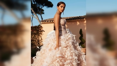 Pooja Hegde also made her Cannes Film Festival debut this year. She graced the red carpet in a shimmery strapless feathered floor-sweeping down. (Instagram/@hegdepooja) Pooja Hegde also made her Cannes Film Festival debut this year. She graced the red carpet in a shimmery strapless feathered floor-sweeping down. (Instagram/@hegdepooja)