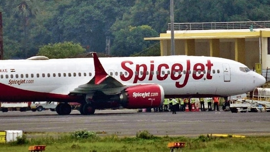 The Delhi-bound SpiceJet airplane following its emergency landing after it catches fire mid-air at Jayprakash Narayan Airport in Patna on Sunday. (HT photo) The Delhi-bound SpiceJet airplane following its emergency landing after it catches fire mid-air at Jayprakash Narayan Airport in Patna on Sunday. (HT photo)