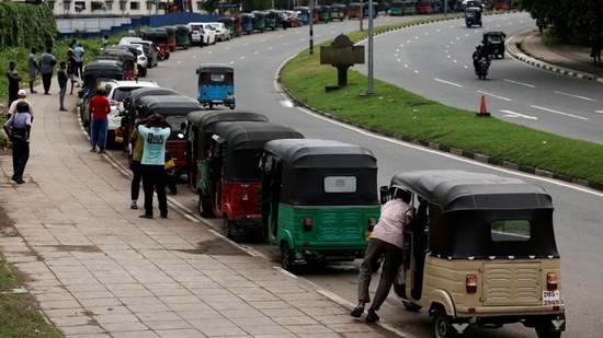 Three-wheeler drivers wait in a queue to buy petrol due to fuel shortage, amid the country's economic crisis, in Colombo, Sri Lanka.(REUTERS)