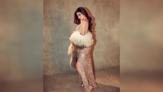Mouni Roy channels her inner Marilyn Monroe as she slips into this breathtaking gown from the shelves of Bhawna Rao couture.(Instagram/@imouniroy)