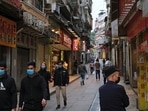 People wear masks as they walk near Ruins of St. Paul’s, following the coronavirus outbreak in Macau, China.