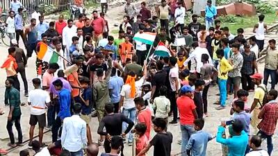 Army aspirants block the railway track during Bharat Bandh, in Araria on Monday. (ANI)