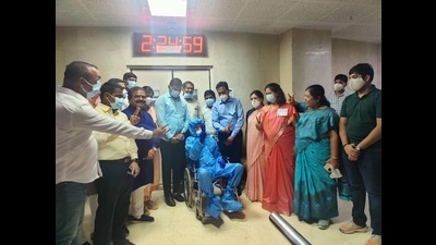 Laxman Jagtap (centre) was seen in a wheelchair surrounded by supporters who were raising slogans. (HT PHOTO)