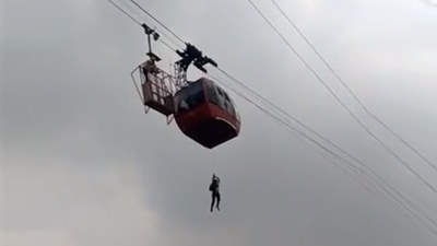 Rescue operation underway to evacuate tourists from a cable car trolley which got stuck mid-air at Parwanoo Timber Trail in Himachal Pradesh. (Twitter/ANI) Rescue operation underway to evacuate tourists from a cable car trolley which got stuck mid-air at Parwanoo Timber Trail in Himachal Pradesh. (Twitter/ANI)