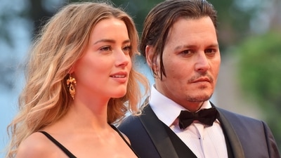 (FILES) In this photo taken on September 04, 2015 US actor Johnny Depp and his wife US actress Amber Heard arrive for screening of Black Mass at the 72nd Venice International Film Festival. A US jury on June 1, 2022 found both of them defamed each other, but sided far more strongly with Johnny. (Photo by GIUSEPPE CACACE / AFP) (AFP) (FILES) In this photo taken on September 04, 2015 US actor Johnny Depp and his wife US actress Amber Heard arrive for screening of Black Mass at the 72nd Venice International Film Festival. A US jury on June 1, 2022 found both of them defamed each other, but sided far more strongly with Johnny. (Photo by GIUSEPPE CACACE / AFP) (AFP)