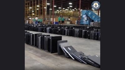 The image, taken from the video posted on Instagram by Guinness World Record, shows laptops toppled in a domino fashion. (Instagram/@Guinness World Record) The image, taken from the video posted on Instagram by Guinness World Record, shows laptops toppled in a domino fashion. (Instagram/@Guinness World Record)