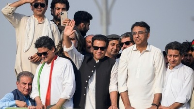 Ousted Pakistan's prime minister Imran Khan (C) waves at his party supporters during a rally in Islamabad. (AFP)