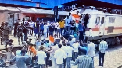 Youth Congress workers protesting in front of a train at Delhi's Shivaji Bridge railway station. Youth Congress workers protesting in front of a train at Delhi's Shivaji Bridge railway station. 