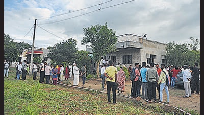 As the news of their death poured in, the entire village gathered around the two residences from where the police recovered bodies. (UDAY DEOLEKAR/HT PHOTO) As the news of their death poured in, the entire village gathered around the two residences from where the police recovered bodies. (UDAY DEOLEKAR/HT PHOTO)