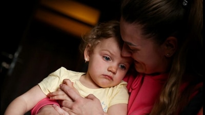 Ukrainian refugees that were granted free accommodation by the hotel owner Krzystof Ciszewski, are pictured at their room in Bratkowice, Poland. (Reuters)
