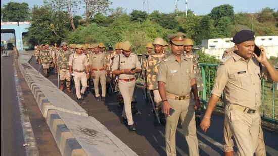 Police personnel staging a march in the Naini area of Prayagraj. (HT PHOTO)