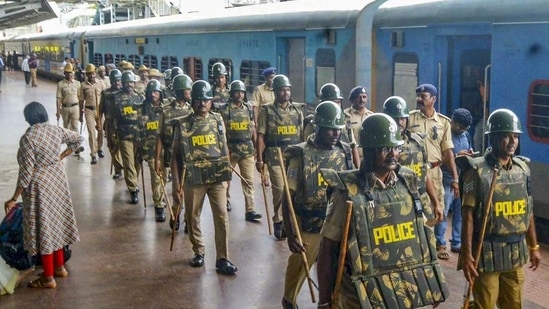 Police personnel deployed at Hubballi railway station on Saturday after security was beefed up following protests against Centre's Agnipath scheme. (PTI)