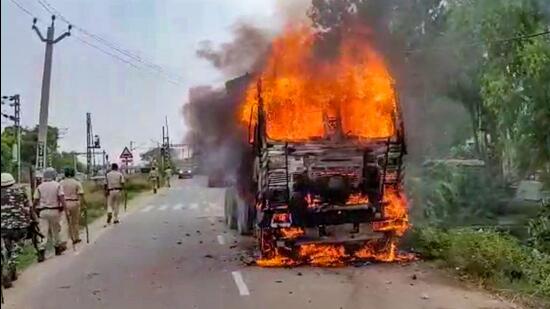 A transport vehicle after it was set on fire by protesters during Bihar Bandh, called to protest against Centre's Agnipath scheme, in Jehanabad, Saturday, June 18. (PTI)