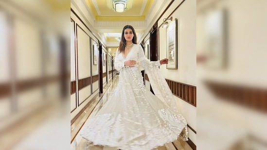Kriti Sanon paired her lehenga with a matching deep-neck blouse and dupatta. The outfit is from the luxury clothing line SHIVAN & NARRESH.(Instagram/@sukritigrover)