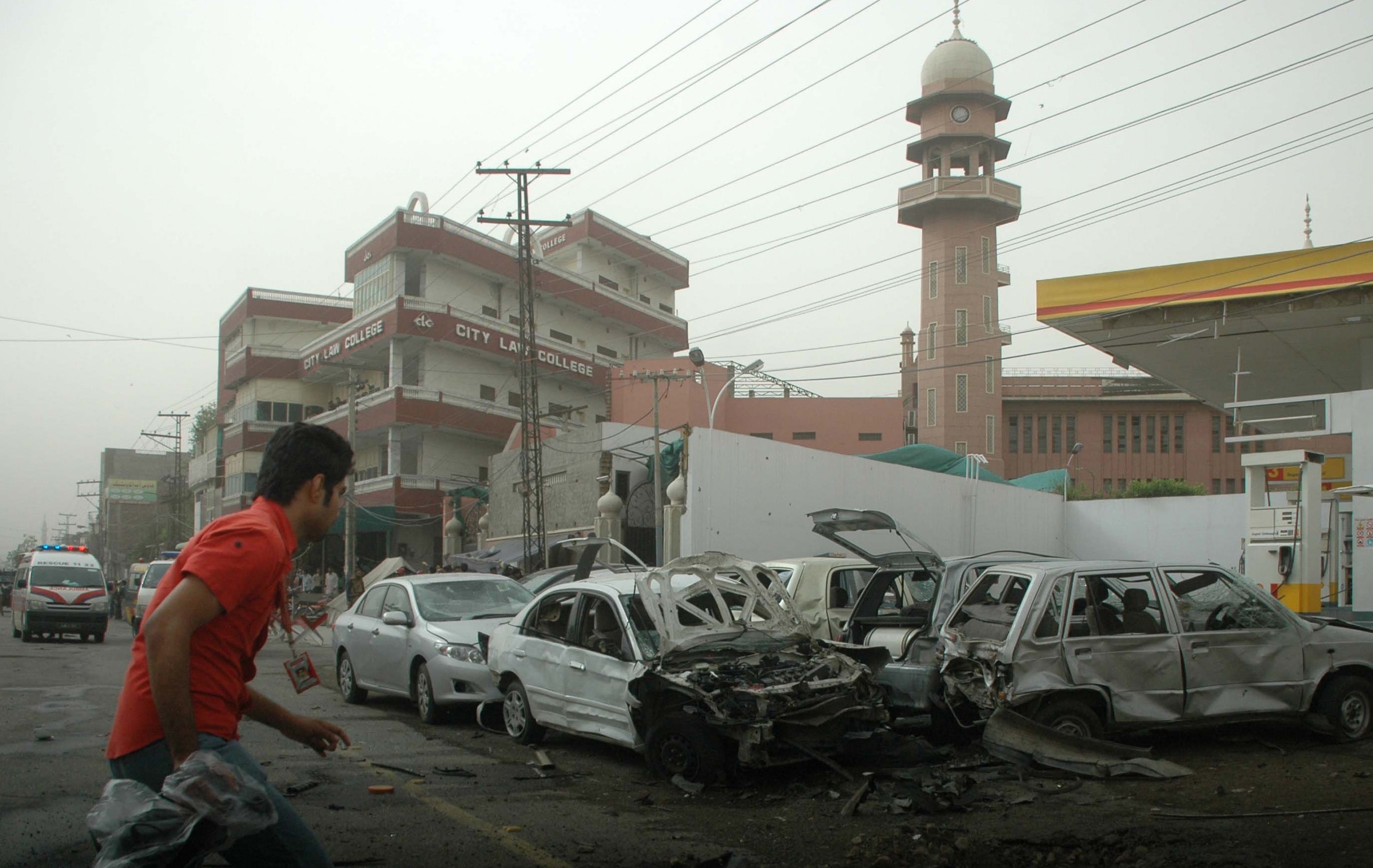 The scene outside the Darul Zikr mosque in Ghari Shahu in Lahore, Pakistan on 28 May 2010. Another Ahmadiyya place of worhip, the Baitul Nur mosque in Model Town was also attacked on the same day. 94 worshippers were killed and 125 were injured. (Nadeem Ijaz/Getty Images)