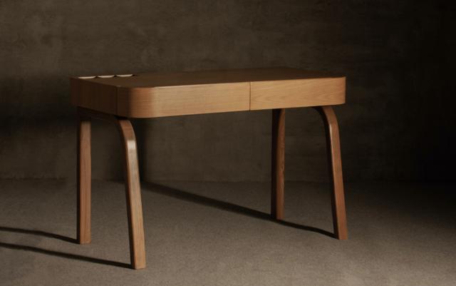 The desk in your den should be functional, as well as make a strong personal style statement. (The Flow Lite desk by BEC furniture)