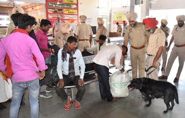 Police checking a passenger’s luggage at the railway station in Amritsar on Monday. (Sameer Sehgal/HT)