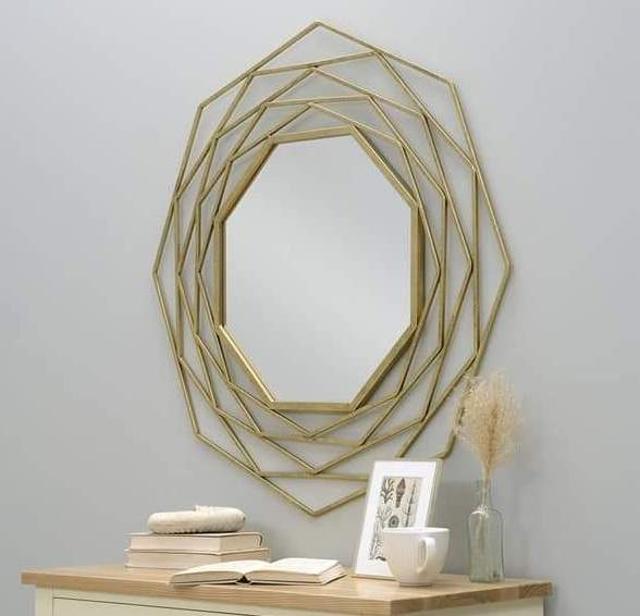 A mirror can fill any dead space or corner. (Iron and brass rectangular mirror by Writings on the wall)