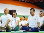 Delhi Chief Minister Arvind Kejriwal along with Dy CM Manish Sisodia and others performs yoga at the Thyagaraj Stadium to celebrate the International Day of Yoga, in New Delhi, Tuesday,(PTI) Delhi Chief Minister Arvind Kejriwal along with Dy CM Manish Sisodia and others performs yoga at the Thyagaraj Stadium to celebrate the International Day of Yoga, in New Delhi, Tuesday,(PTI)