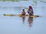 A woman with children rows a raft made from banana trees toward a safer area from the flooded village of Tarabari, in the northeastern Indian state of Assam. (AP Photo/Anupam Nath)(AP) A woman with children rows a raft made from banana trees toward a safer area from the flooded village of Tarabari, in the northeastern Indian state of Assam. (AP Photo/Anupam Nath)(AP)
