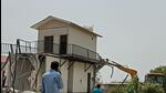 A farmhouse built on Yamuna floodplains being razed. (Sourced) A farmhouse built on Yamuna floodplains being razed. (Sourced)