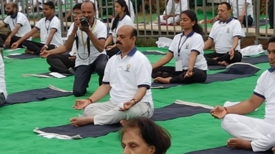 Karnataka Chief Minister Basavaraj Bommai and other dignitaries performed yoga at the event. Karnataka Chief Minister Basavaraj Bommai and other dignitaries performed yoga at the event.