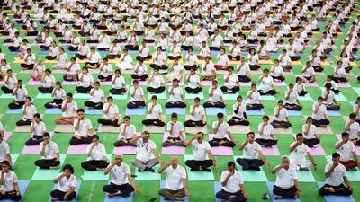 New Delhi, June 21 (ANI): Delhi Chief Minister Arvind Kejriwal with Deputy Chief Minister Manish Sisodia participates in “Delhi ki Yogshaala” on the occasion of the 8th International Day of Yoga 2022, at Thyagraj Stadium, in New Delhi on Tuesday. (ANI Photo) (ANI)