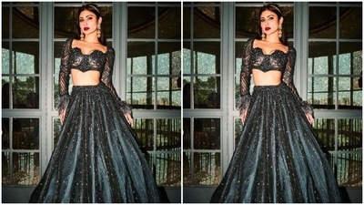 In golden statement jhumkas, a hairband and a ring from the shelves of AKM Mehrasons Jewellers, Mouni added more bling to her look. (Instagram/@imouniroy)