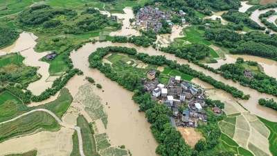 This aerialshows flooded fields and buildings following heavy rains in Rongan in China's southern Guangxi region. (AFP) This aerialshows flooded fields and buildings following heavy rains in Rongan in China's southern Guangxi region. (AFP)