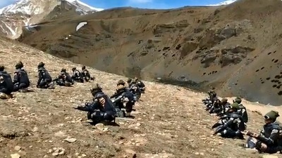 International Yoga Day 2022: The image taken from a Twitter video shows the ITBP’s Himveers performing yoga at 14,500 feet in Uttarakhand. (Twitter/@ITBP_official)