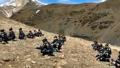 International Yoga Day 2022: The image taken from a Twitter video shows the ITBP’s Himveers performing yoga at 14,500 feet in Uttarakhand. (Twitter/@ITBP_official)