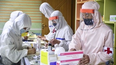 Members of the North Korean army supply medicines to residents at a pharmacy, amid growing fears over the spread of the coronavirus disease (COVID-19), in Pyongyang, North Korea. (via REUTERS)