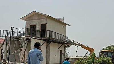 A farmhouse built on Yamuna floodplains being razed. (Sourced)