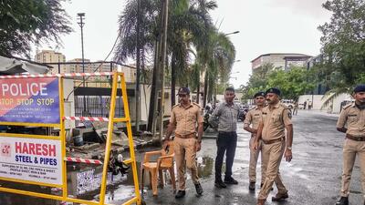 The Surat Police outside a hotel where Shiv Sena leader Eknath Shinde and a group of party lawmakers are camping (PTI) The Surat Police outside a hotel where Shiv Sena leader Eknath Shinde and a group of party lawmakers are camping (PTI)
