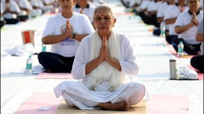 Uttar Pradesh governor Anandiben Patel doing yoga at Raj Bhavan in Lucknow on the occasion of International Yoga Day on Tuesday. (Deepak Gupta/HT Photo) Uttar Pradesh governor Anandiben Patel doing yoga at Raj Bhavan in Lucknow on the occasion of International Yoga Day on Tuesday. (Deepak Gupta/HT Photo)