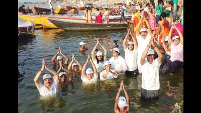 Activists performing Jal Yoga in the Ganga on Tuesday. (HT Photo)