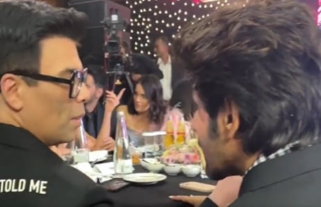 Karan Johar and Kartik Aaryan at a recent awards event, where they sat at the same table.&nbsp;