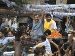 Delhi Chief Minister and AAP Convener Arvind Kejriwal waves at the supporters during a roadshow for Rajinder Nagar assembly constituency by-elections, at Inder Puri in New Delhi.(PTI) Delhi Chief Minister and AAP Convener Arvind Kejriwal waves at the supporters during a roadshow for Rajinder Nagar assembly constituency by-elections, at Inder Puri in New Delhi.(PTI)