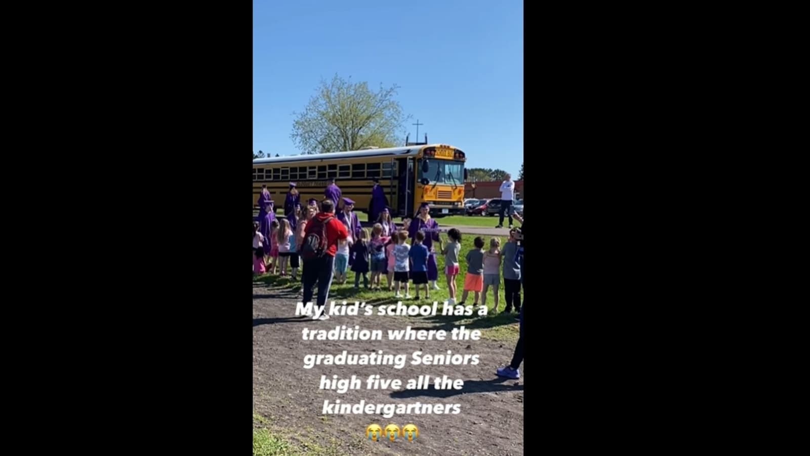 Graduating seniors high five kindergarteners in sweet tradition at school. Watch