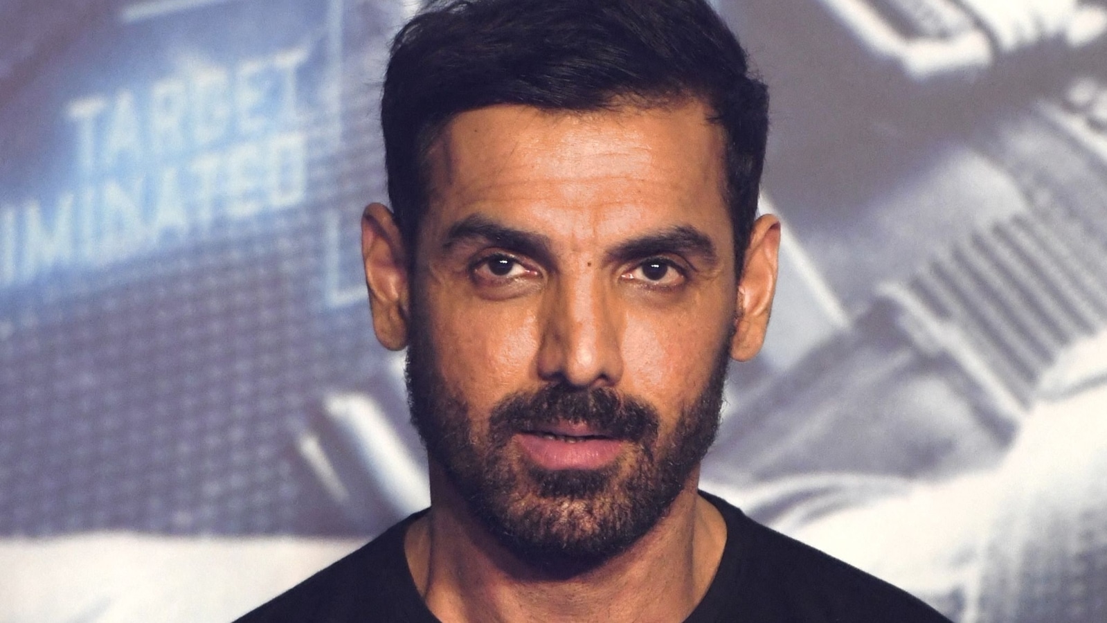 Legs are over the butt for John Abraham