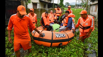 National Disaster Response Force (NDRF) personnel rescue people from a flood-affected area, Kamrup, June 21, 2022 (PTI) National Disaster Response Force (NDRF) personnel rescue people from a flood-affected area, Kamrup, June 21, 2022 (PTI)