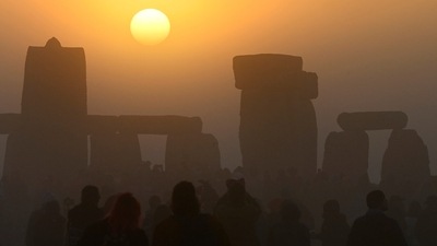 About 6,000 people gathered at the ancient stone circle in southern England to watch the sun rise at 4:49 a.m. on a clear, crisp morning, local police said. (REUTERS)