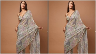The ivory white saree featured floral details in multicolour shades. She teamed it with sleeveless blouse of the same print. (Instagram/@egupta)