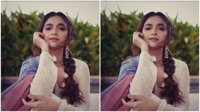 Keerthy decked up in a white dress intricately decorated in golden beads and a pink border at the ankles. She further layered her look with a pastel blue and a pink and white striped dupatta. (Instagram/@keerthysureshofficial)