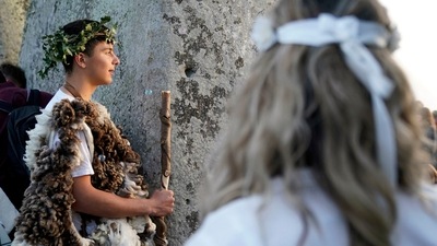 It was the first time revellers have been permitted to gather at the Neolithic monument to celebrate the solstice since 2019. (AP) It was the first time revellers have been permitted to gather at the Neolithic monument to celebrate the solstice since 2019. (AP)