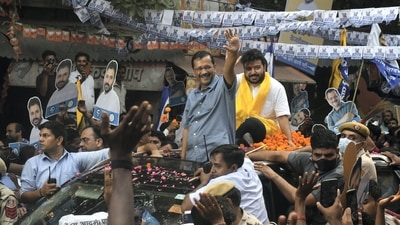 Delhi Chief Minister and AAP Convener Arvind Kejriwal waves at the supporters during a roadshow for Rajinder Nagar assembly constituency by-elections, at Inder Puri in New Delhi. (PTI)