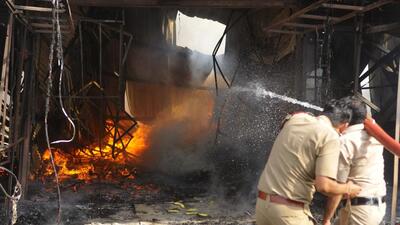 Firefighters dousing the flames at the furniture market on the Sector 53/54 dividing road in Chandigarh on Wednesday. (Keshav Singh/HT) Firefighters dousing the flames at the furniture market on the Sector 53/54 dividing road in Chandigarh on Wednesday. (Keshav Singh/HT)